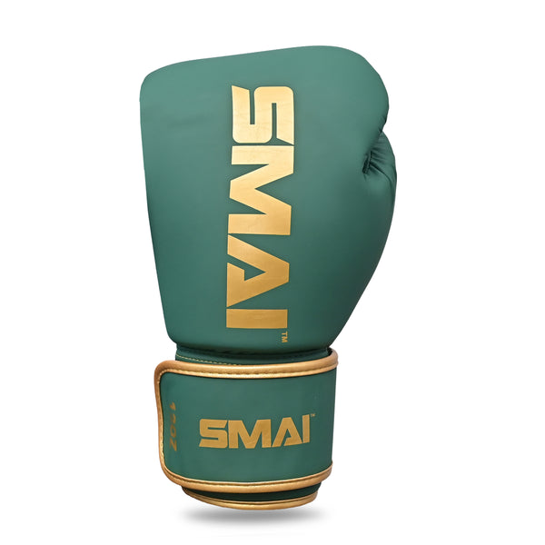 Introducing the SMAI Gold Series Boxing Glove in Green/Gold, featuring bold gold "SMAI" lettering on both the top and wrist strap. Expertly designed to deliver superior shock protection and enhanced wrist support for even your most intense training sessions.