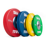 A vibrant set of SMAI Competition Bumper Plates is arranged in a line, featuring weights of 25 kg (red), 20 kg (blue), 15 kg (yellow), and 10 kg (green). Each plate from the Competition Bumper Plate Set with Barbell - 140kg is ideal for Olympic weightlifting and pairs perfectly with bearing barbells.