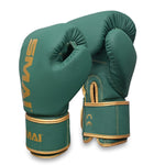 A pair of SMAI Gold Series Boxing Gloves in green with gold trim and lettering. Designed for optimal wrist support and shock protection, the gloves are shown upright, displaying one glove’s front and the other’s back.