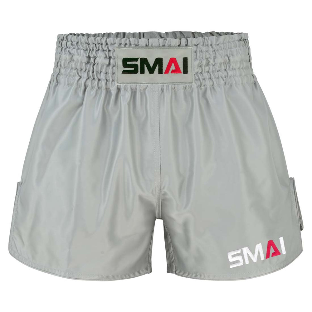 Grey SMAI Muay Thai Shorts - Grey satin polyester with an elastic waistband and brand logos on the front center and lower leg.