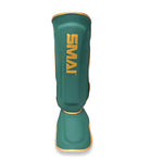 Introducing the Gold Series Muay Thai Shin Guards by SMAI in green and gold, featuring bold yellow "SMAI" branding on the front. Specially designed for leg protection in sports and martial arts, these shin guards offer superior impact absorption with high-density foam shielding.