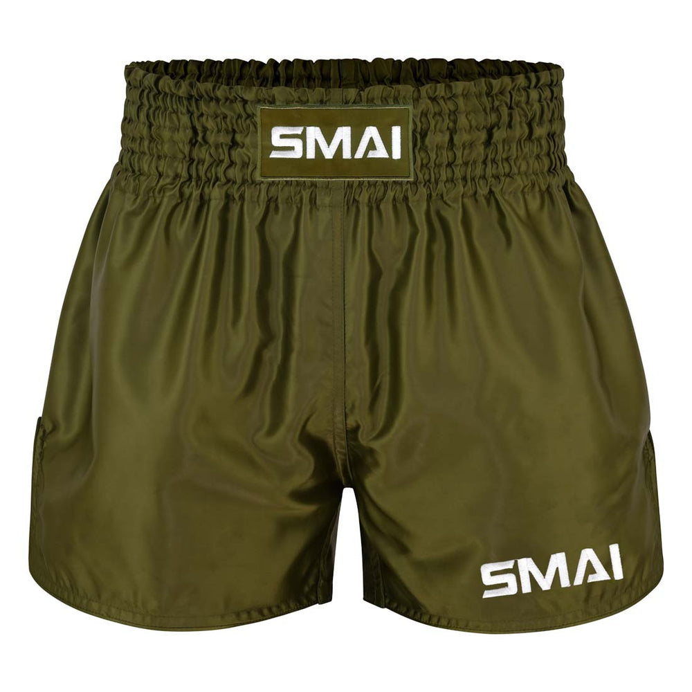 SMAI Muay Thai Shorts - Olive Green featuring an elastic waistband and white logo text on the front leg and center waist.