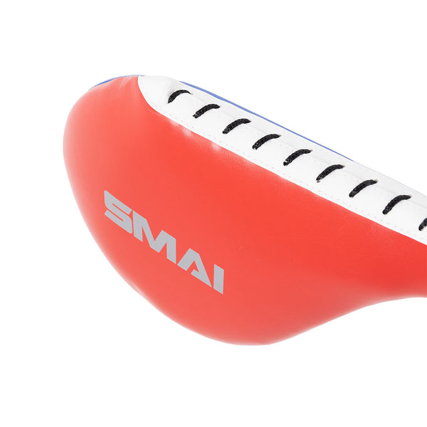 A close-up of the SMAI TKD Single Kicking Paddle in red and white with black stitching and a white "SMAI" logo, ideal for children's training drills.