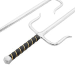 A close-up of the SMAI Sai - Steel Chrome Rounded with a black handle wrapped in yellow cord, featuring outward-curving prongs—a classic Okinawan training weapon. Another sai is partially visible in the background.