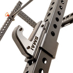 Close-up of the SMAI Folding Wall Mounted Squat Rack, showcasing its numbered holes and sturdy J-hook for securely holding a barbell. This rack is ideal for maximizing space in your garage gym while delivering dependable support throughout your workouts.