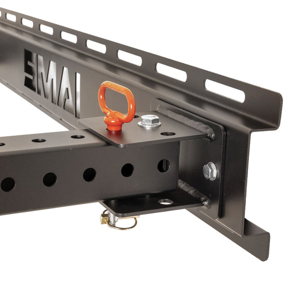 The SMAI Folding Wall Mounted Squat Rack features a sturdy black metal beam with multiple holes, securely attached to a slotted support bracket. A small orange ring and metal fasteners are visible at the joint atop the beam, making this product an excellent choice for any garage gym setup.