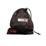 A black mesh drawstring bag with a visible “SMAI” logo patch, partially revealing the red and black Suspension Trainer - GTS by SMAI inside—ideal for storing your portable fitness equipment or taking your gravity training system wherever you go.