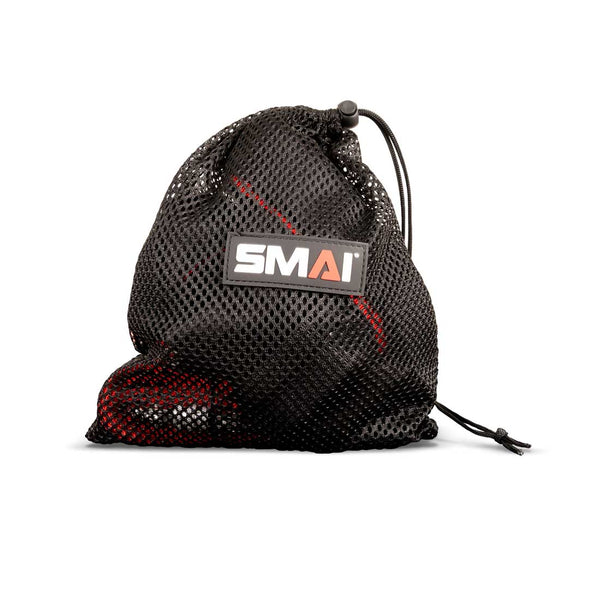 A black mesh drawstring bag with a visible “SMAI” logo patch, partially revealing the red and black Suspension Trainer - GTS by SMAI inside—ideal for storing your portable fitness equipment or taking your gravity training system wherever you go.