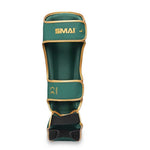 Introducing the Gold Series Muay Thai Shin Guards in Green/Gold by SMAI, featuring superior right-leg protection with multi-layer EVA construction, reinforced high-density foam for enhanced comfort and durability, and adjustable straps for a secure fit.