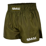 SMAI Muay Thai Shorts - Olive Green featuring a wide elastic waistband and brand logos on the center front and lower left leg.