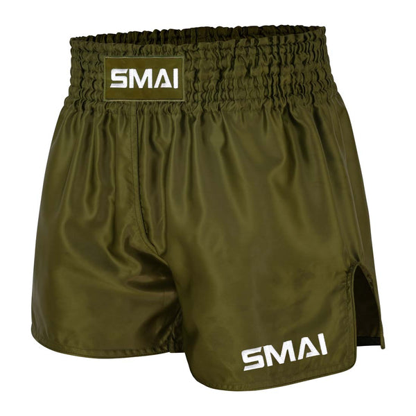 SMAI Muay Thai Shorts - Olive Green featuring a wide elastic waistband and brand logos on the center front and lower left leg.