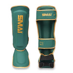 Presenting the SMAI Gold Series Muay Thai Shin Guards in Green/Gold, displayed from both front and back perspectives. These guards feature bold gold trim and "SMAI" in striking gold lettering, and are equipped with multi-layer EVA padding for superior comfort and long-lasting durability.