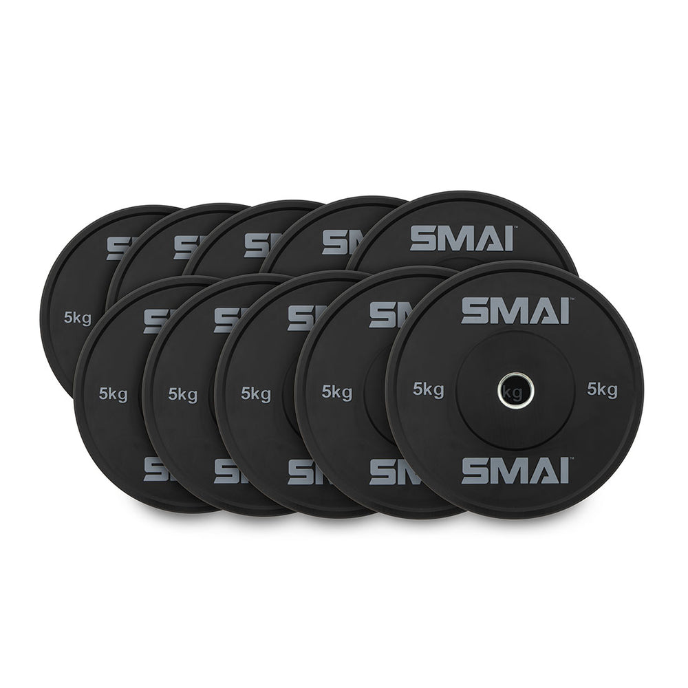 A set of HD Bumper Plates from Sale Item, consisting of ten commercial-grade plates weighing 5 kg each, is neatly arranged in two overlapping rows, showcasing top-tier gym equipment.