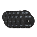A set of HD Bumper Plates from Sale Item, consisting of ten commercial-grade plates weighing 5 kg each, is neatly arranged in two overlapping rows, showcasing top-tier gym equipment.
