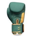 The SMAI Gold Series Boxing Glove in Green/Gold features visible stitching and a velcro strap for excellent wrist support, shown standing upright on a white background.