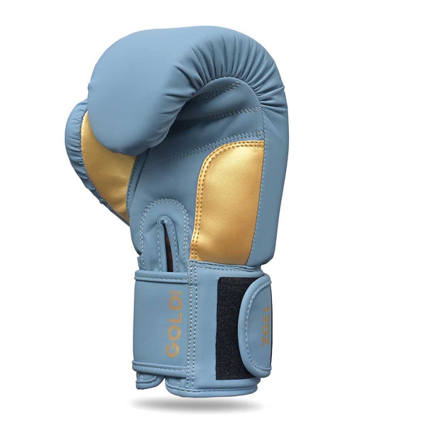 The SMAI Gold Series Boxing Glove - Light Blue/Gold is shown upright with the thumb tucked in, featuring a black Velcro strap at the wrist displaying "GOLD" and "12OZ" in gold text. Designed for superior wrist support, these gloves provide both comfort and security during intense training sessions.