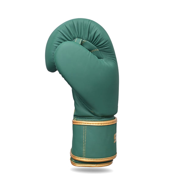 The SMAI Gold Series Boxing Glove in Green/Gold is displayed upright against a white background, highlighting its gold trim and optimal wrist support design.