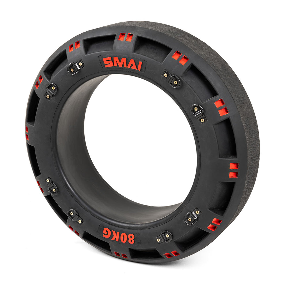 The SMAI 80kg Strongman Functional Tyre, in black with red "80KG" lettering, includes chain handles and red accents with evenly spaced metal fixtures. The tyre stands upright on a white background, ready for your next boot camp challenge.