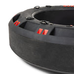Close-up of the SMAI 80kg Strongman Functional Tyre, large and round with black textured sides and red accents. It includes chain handles and metal edge rings, ideal for boot camp workouts or strength training. The worn surface indicates frequent use in intense fitness routines.