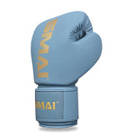 The SMAI Gold Series Boxing Glove in Light Blue/Gold is displayed upright against a white background, featuring gold "SMAI" lettering on both the wrist strap and back. Designed for excellent wrist support, this glove enhances comfort and protection during training.