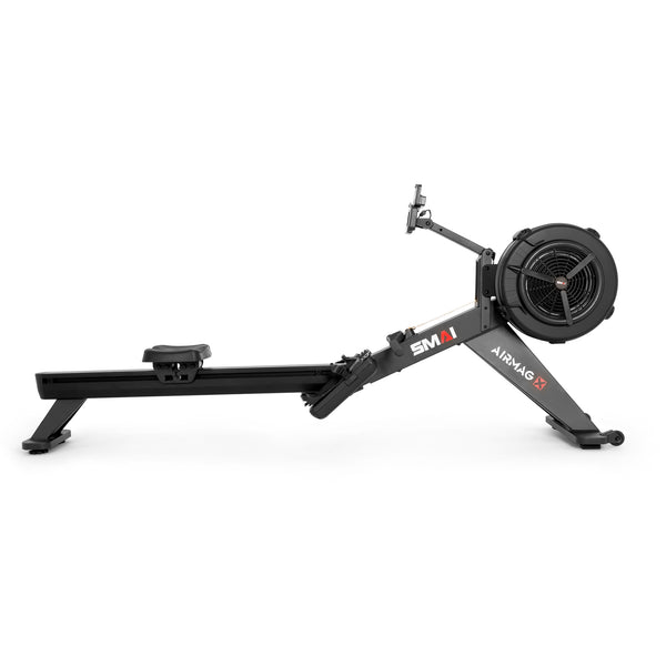 Black SMAI AirMag X Rower with a large flywheel, a sliding seat, and a mounted tablet holder for advanced rowing.