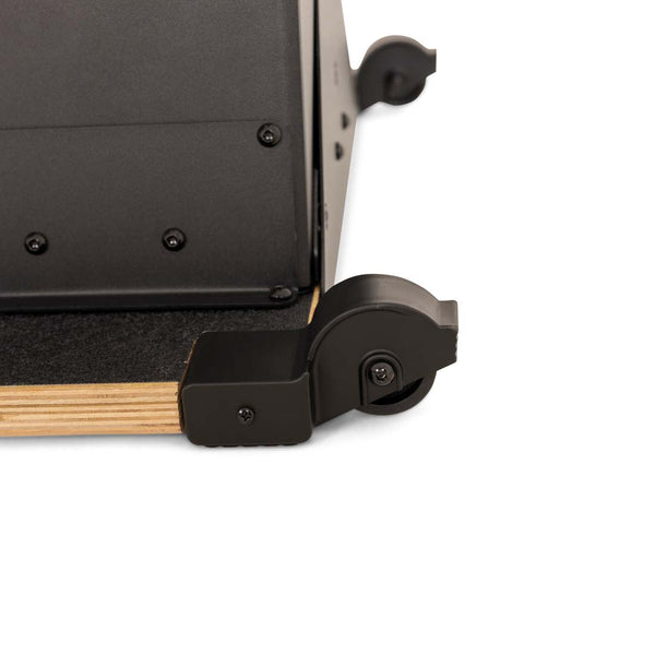 Close-up of the base of an AirMag X Skier, showing a small black wheel attached to a wooden platform.