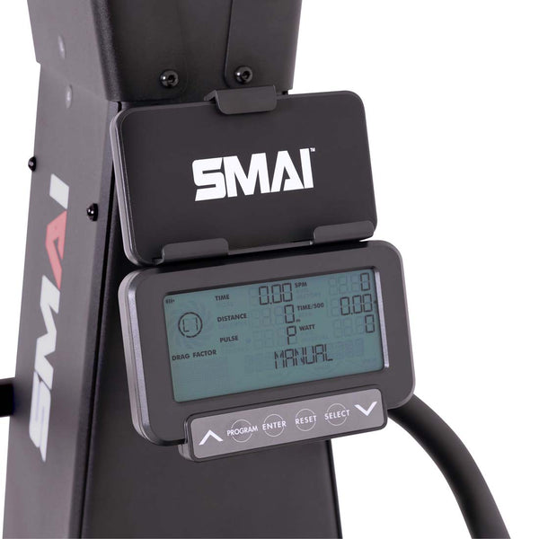 Close-up of an SMAI AirMag X Skier console displaying performance metrics including time, distance, and pulse, with navigation buttons below the screen.