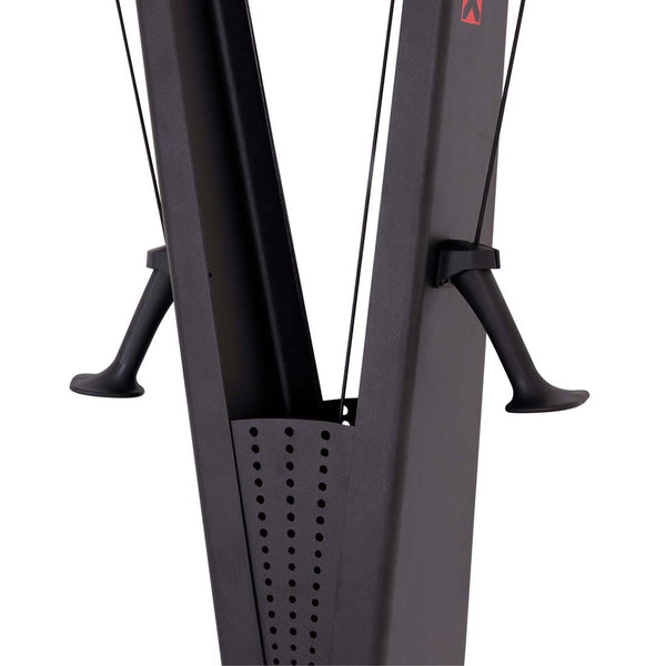Close-up of an SMAI AirMag X Skier showing the vertical frame, two handles attached by cords, and a perforated metal guard.
