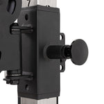 Close-up of a black adjustment knob attached to a metal bracket on the SMAI Functional Trainer, mounted on a vertical silver frame.