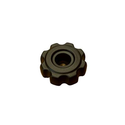 The SMAI Air Spin - Locking Knob is a black, round plastic knob with six scalloped edges and a central hole—perfect as a replacement part for your Air Spin Bike.