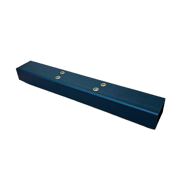 The SMAI Air Spin - Rear Stabiliser (foot) is a rectangular dark blue metal part with beveled edges and four screw holes on top, photographed on a white background. Perfect as a spare replacement for your Air Spin Bike.