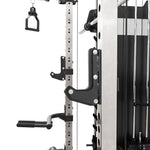 Close-up of the SMAI All in 1 Functional Trainer at a gym, featuring adjustable metal hooks, numbered height settings, and multiple handles for versatile strength training.
