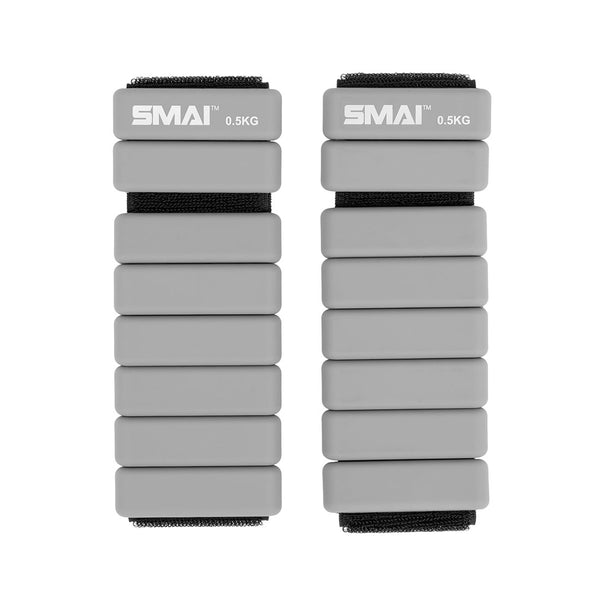A pair of SMAI Weighted Ankle / Wrist Bracelets 0.5KG in grey, featuring black straps and "SMAI 0.5KG" labeling—ideal for adding resistance to your workouts.