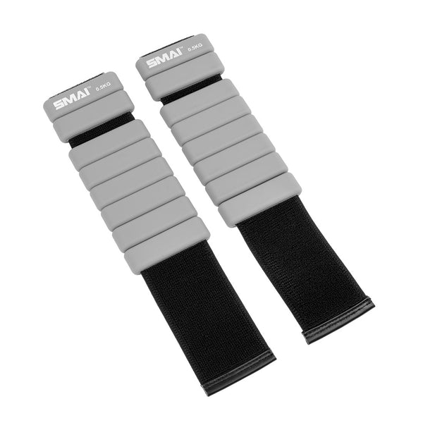 The SMAI Weighted Ankle / Wrist Bracelets 0.5KG (Pair) in grey feature black elastic straps with attached rectangular weights, making them ideal for resistance training and exercise.