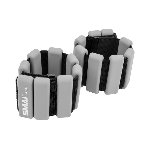 Enhance your workouts with the SMAI Weighted Ankle / Wrist Bracelets 0.5KG (Pair) - Grey, featuring adjustable fit and rectangular padding for comfort and resistance—ideal for training routines.