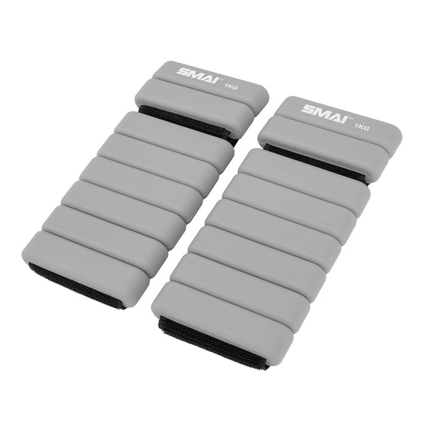 The SMAI Weighted Ankle / Wrist Bracelets 1KG (Pair) in grey feature segmented padding and black adjustable straps, ideal for resistance training.