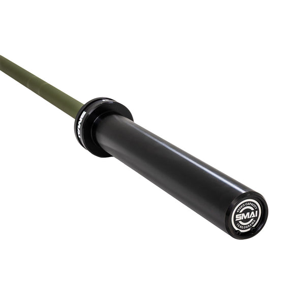 A close-up of the SMAI Barbell - Army Green Ceramic Coat - 15kg shows its black sleeve, olive-green ceramic-coated shaft, and an end cap labeled "SMAI" with product details in white text.