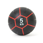 An SMAI black commercial medicine ball, part of the 34kg set, features red stripes and "5 KG" printed in white on the front. Designed for CrossFit workouts, it sits centered on a light surface, highlighting its slip-resistant durability.