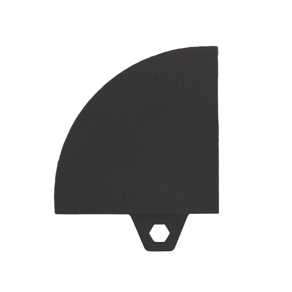 A black TPE Gym Flooring Edge / Corner Accessory from No Sync To Channel Engine, featuring a quarter-circle shape on the upper left with a distinctive hexagonal hole at the bottom center, and resembling the textured surface of rubber gym flooring.