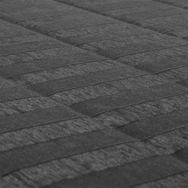 Close-up of the SMAI Roll Out Workout Mat - Dollamur Flexi Roll in black, featuring a dark gray quilted surface with grid-pattern stitching that mimics tatami-textured vinyl for enhanced grip—perfect for workouts.