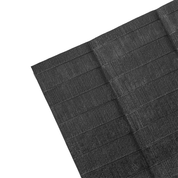 A close-up of the SMAI Roll Out Workout Mat - Dollamur Flexi Roll in black, featuring a tatami-textured vinyl surface with horizontal and vertical lines, displayed at an angle against a white background.