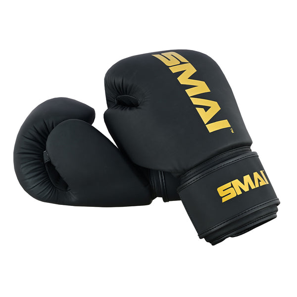 A pair of PRE ORDER - Gold Series Boxing Glove - Black/Gold by SMAI, featuring gold "SMAI" lettering on the wrists and backs, displayed against a white background.