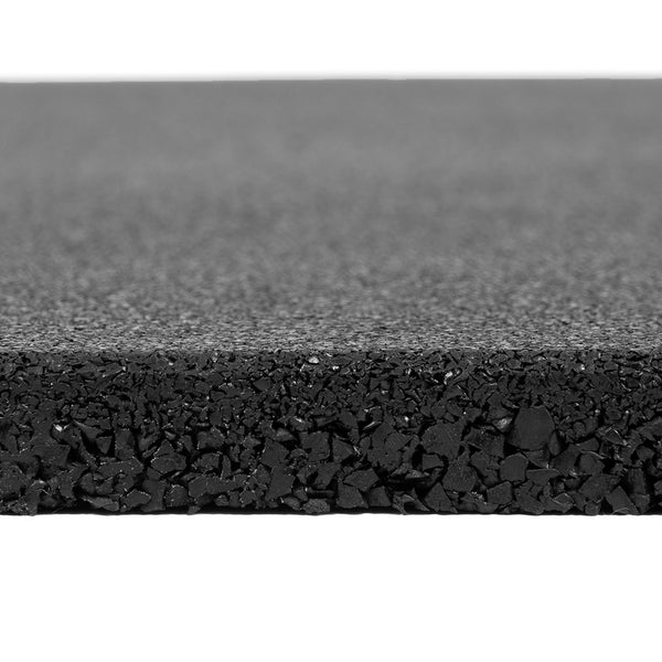 Close-up of the SMAI Rubber Course Granule Gym Flooring Tile - 15mm in black, showing its smooth top and coarse granule cross-section. The tile’s anti-slip surface is displayed clearly against a plain white background.