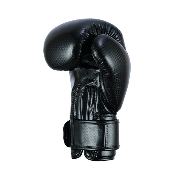 The SMAI PRE ORDER: Essentials Kids Boxing Glove - Black is displayed upright, featuring a textured surface and Velcro strap, against a plain white background.