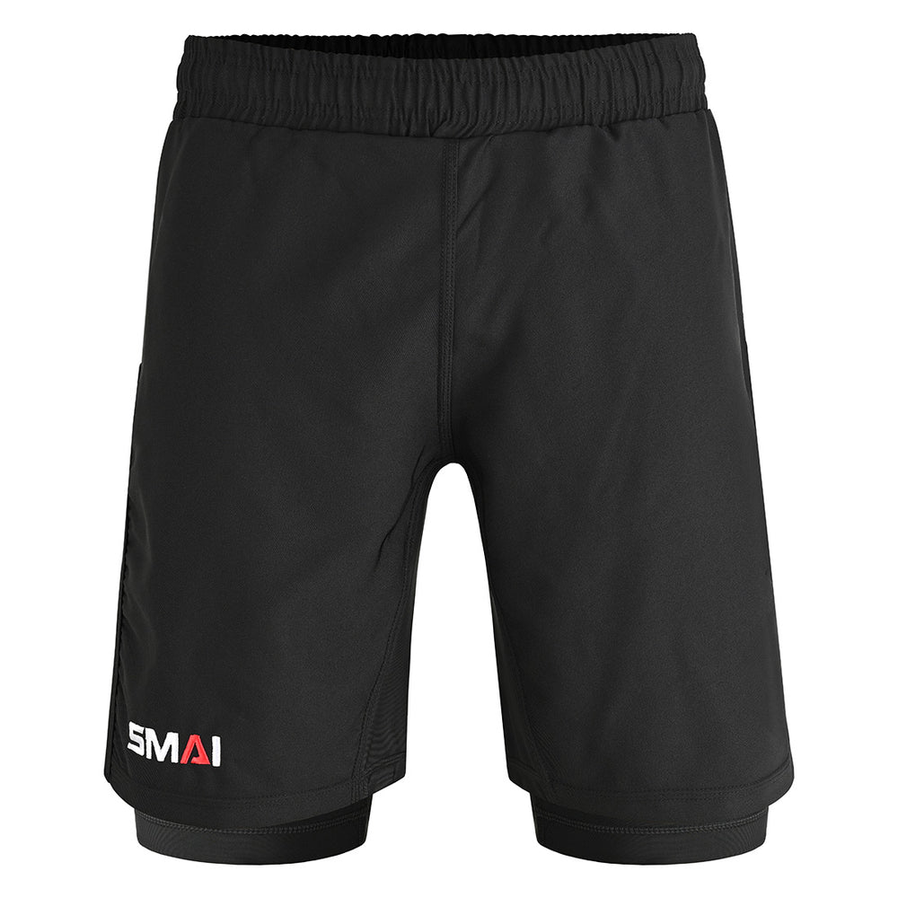 The SMAI Hybrid MMA Grappling Shorts in black feature an elastic waistband, subtle double-layer design, and “SMAI” printed in white and red on the lower left leg. These plain fight shorts have no visible pockets or patterns.