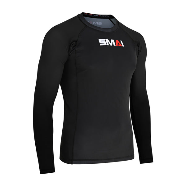 The SMAI Long Sleeve Rash Guard - Black features a crew neck, visible seam stitching for durability and comfort, and displays the white and red SMAI logo on the chest. Ideal for no-gi BJJ training.