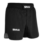 The SMAI MMA Grappling Shorts - Black feature "SMAI" in white on the waistband and left leg, made from durable polycotton with an elastic waistband, Velcro closure, and a small side slit for flexibility.