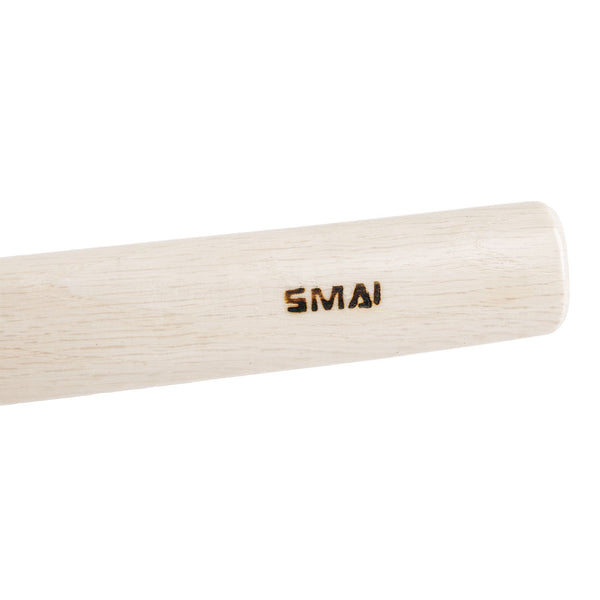 A close-up of SMAI’s Bokken - White Oak Stained Beechwood, featuring the brand name engraved on its smooth surface, resembling a traditional Japanese wooden sword for martial arts training.