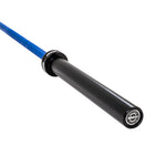 A close-up of the SMAI Barbell - Blue Ceramic Coat - 20kg highlights its blue ceramic-coated bar, black sleeve, and end cap with the SMAI logo, focusing on one end against a white background.