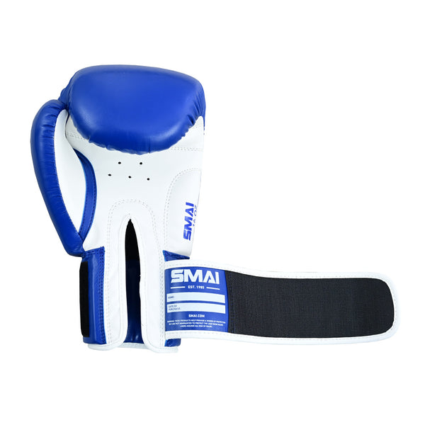 The SMAI Essentials Boxing Glove - Blue features a blue and white design with an extended black wrist strap, SMAI branding on both the strap and glove, displayed against a white background—ideal for sparring in your boxing sessions.